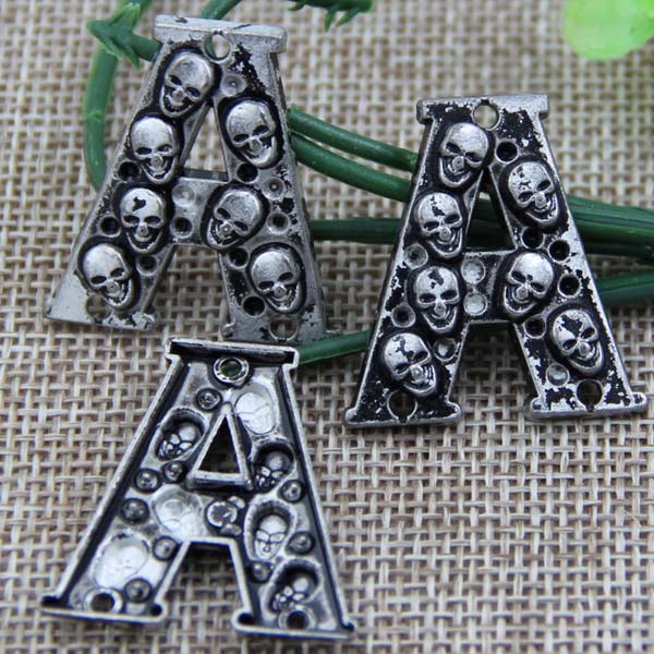 G095 Letter Skull Sew Spikes 27mm A,27mm C,25mm D,24mm H,21mm L,24mm N 100pcs/bag